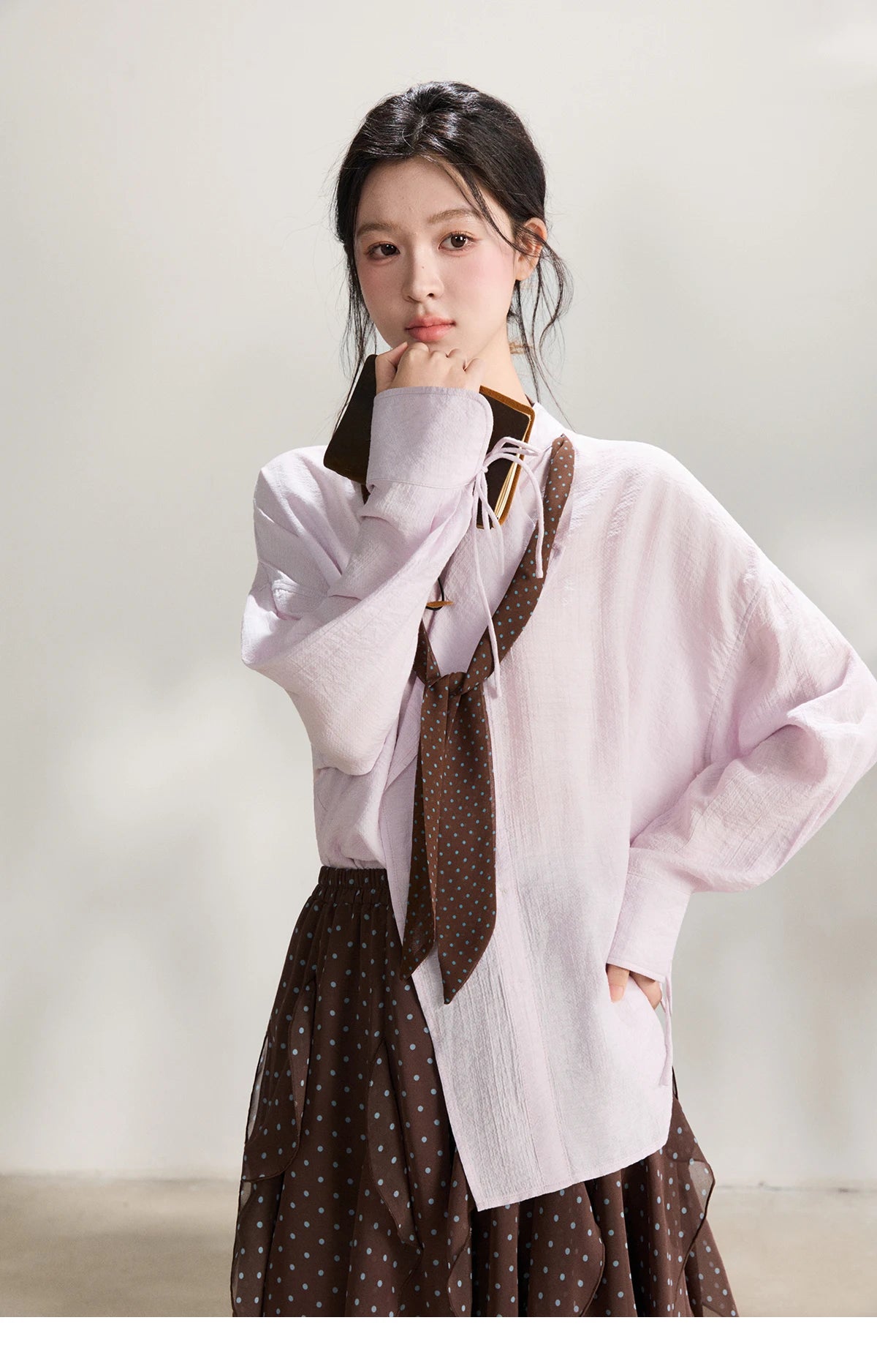 MISHOW Women's Asymmetric V Neck Shirts 2026 Spring Lapel Casual Loose Tie Cuffs Solid Shirt with Polka Dot Ribbon MXF108X1002