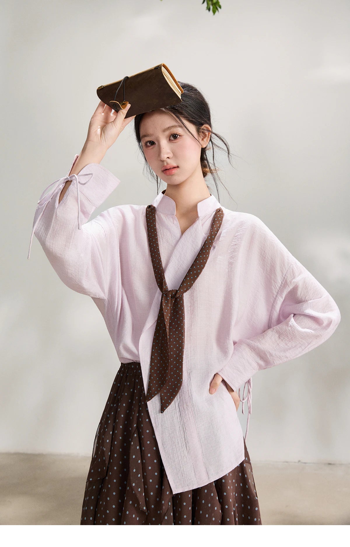 MISHOW Women's Asymmetric V Neck Shirts 2026 Spring Lapel Casual Loose Tie Cuffs Solid Shirt with Polka Dot Ribbon MXF108X1002