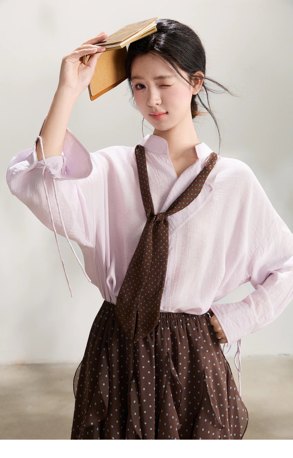 MISHOW Women's Asymmetric V Neck Shirts 2026 Spring Lapel Casual Loose Tie Cuffs Solid Shirt with Polka Dot Ribbon MXF108X1002
