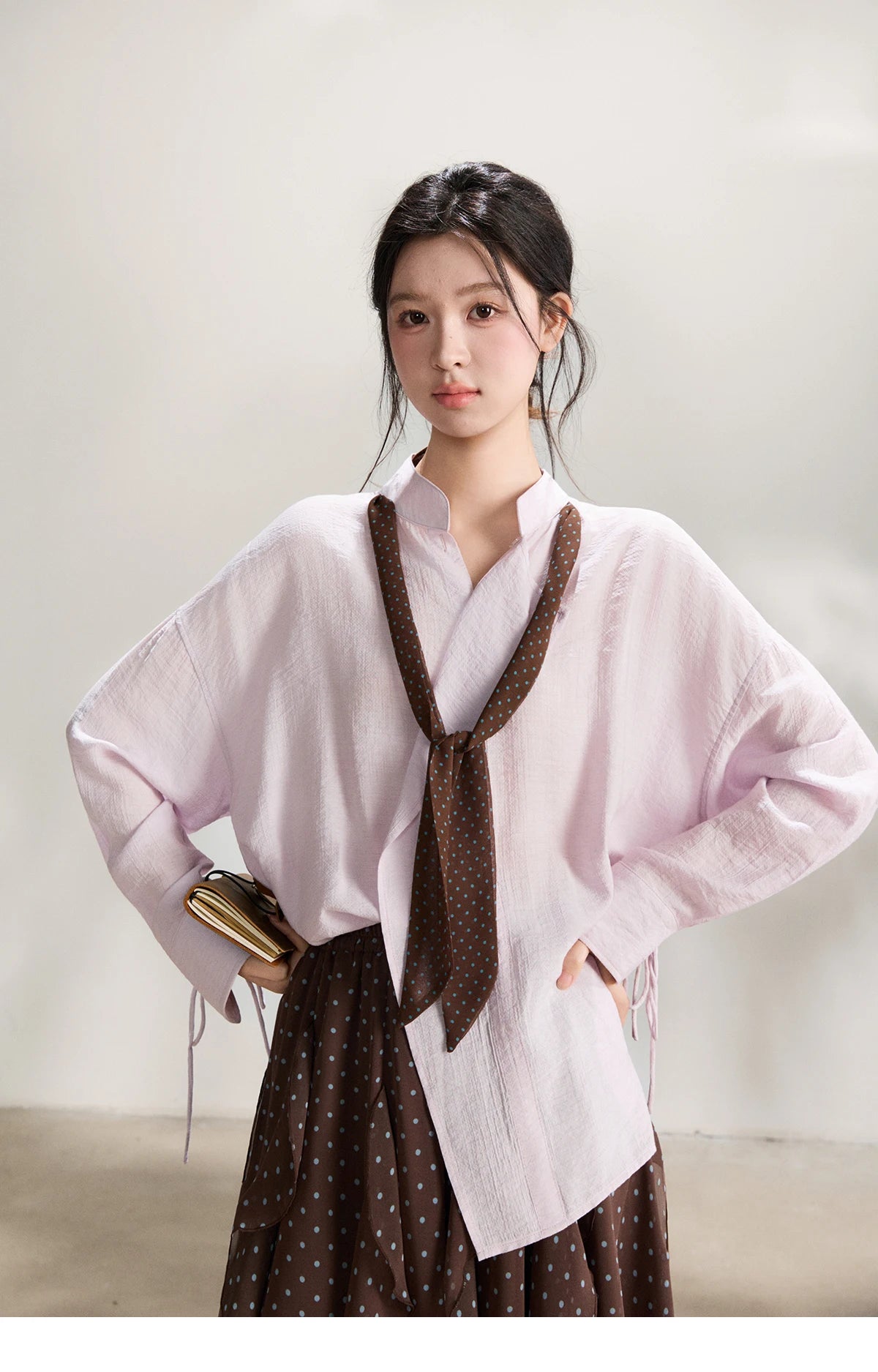 MISHOW Women's Asymmetric V Neck Shirts 2026 Spring Lapel Casual Loose Tie Cuffs Solid Shirt with Polka Dot Ribbon MXF108X1002